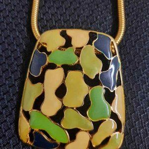 MC abstract enamel gold toned metal pendant with coil necklace.